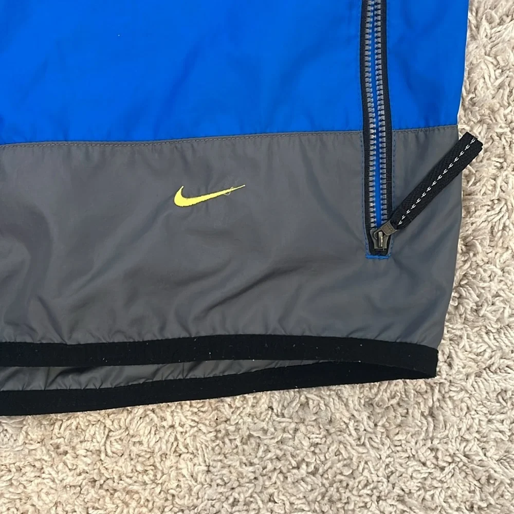 Nike youth L royal blue grey 1/2 zip windbreaker. Loose fit. Great condition